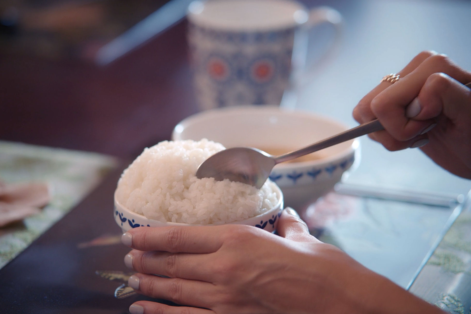 White rice, or “sticky” rice, can be eaten with a spoon or chopsticks
